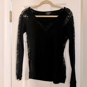 Bebe black ribbed long sleeve shirt with lace on sleeves, sides and neck.